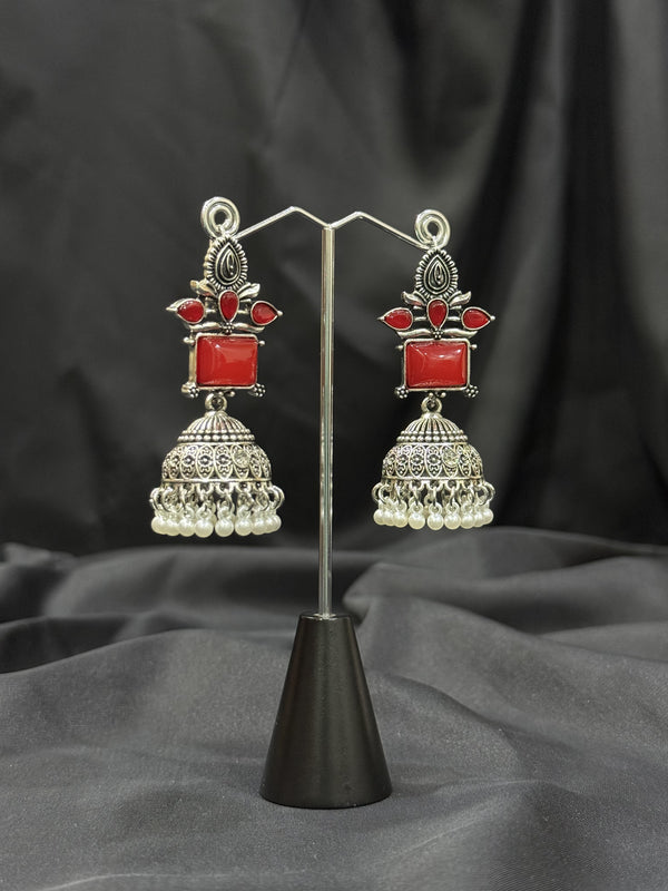 Silver Jhumka Earrings With Red Stone