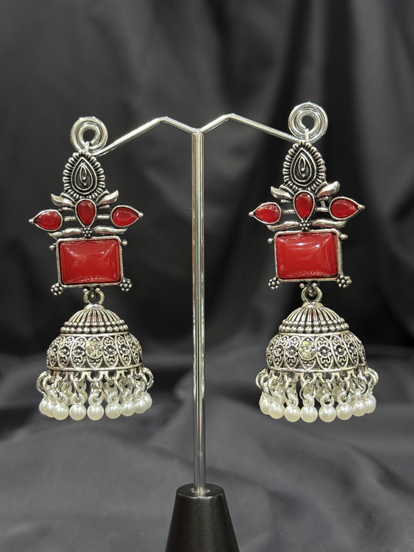Silver Jhumka Earrings With Red Stone